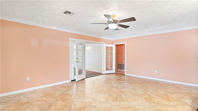 empty room featuring ceiling fan, baseboards, ornamental molding, and visible vents