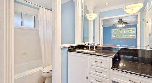 full bathroom with ceiling fan, toilet, shower / bath combination with curtain, vanity, and crown molding