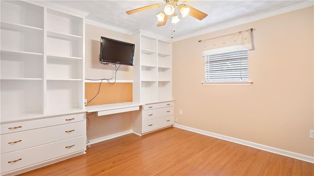 unfurnished bedroom featuring crown molding, ceiling fan, built in desk, and light hardwood / wood-style flooring