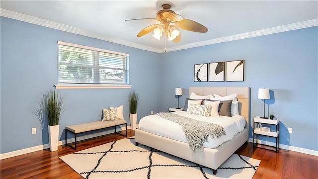 bedroom featuring baseboards, wood finished floors, ceiling fan, and crown molding