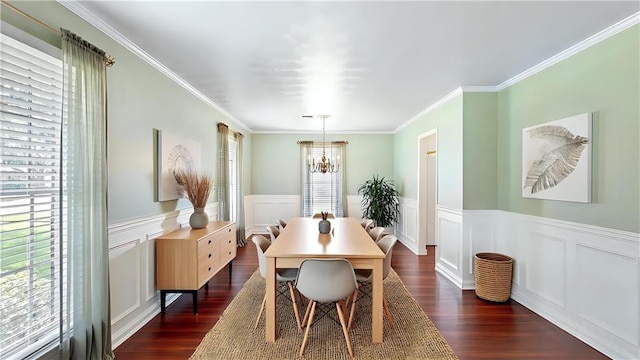 dining area with wainscoting, dark wood-type flooring, and a notable chandelier