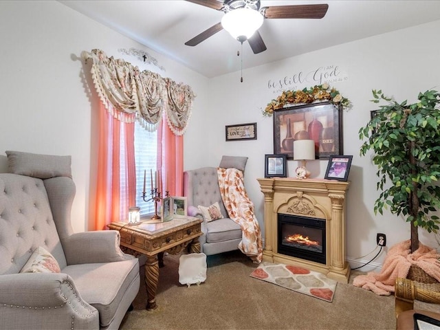 living area with ceiling fan and carpet floors