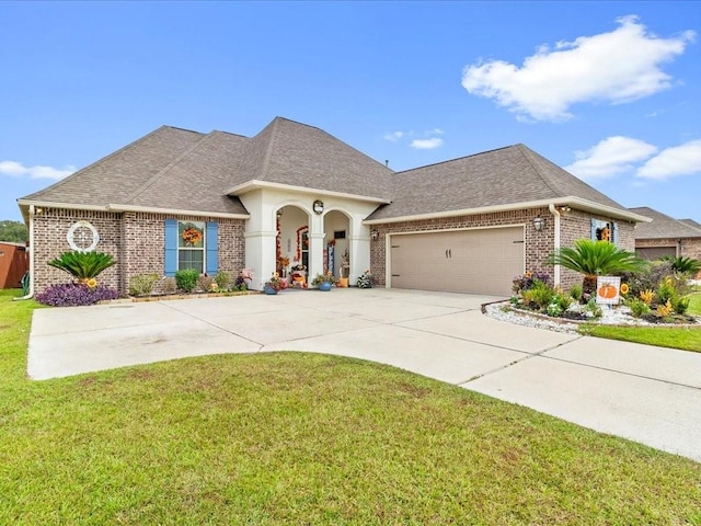 view of front of property featuring a garage and a front yard