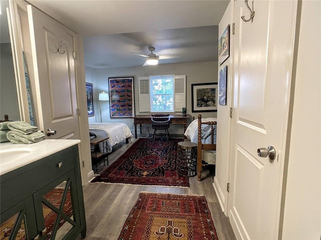 bedroom with hardwood / wood-style floors and ceiling fan