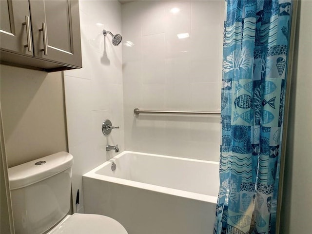 bathroom featuring shower / bath combo and toilet