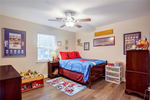 bedroom featuring ceiling fan and wood-type flooring