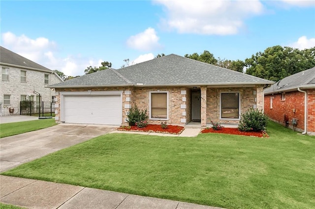 view of front of home featuring a garage and a front yard