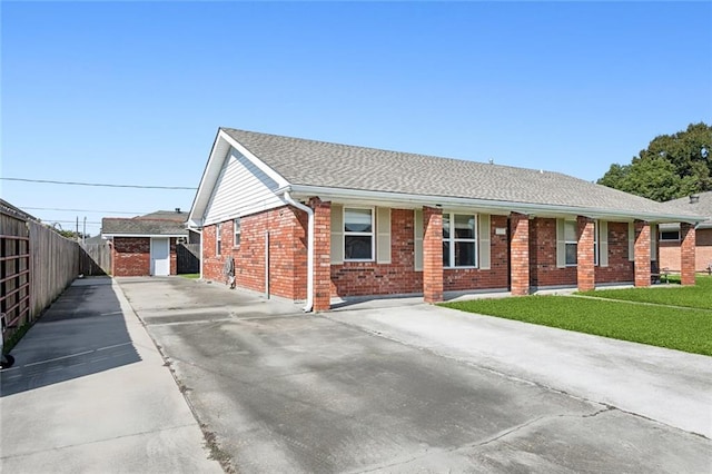 ranch-style house with a front lawn