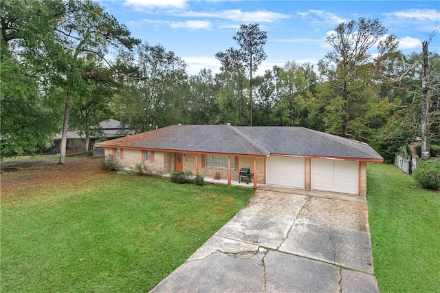 single story home featuring a garage and a front lawn