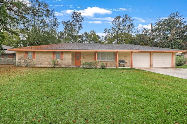 ranch-style home with a front lawn and a garage