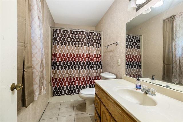 full bathroom featuring vanity, shower / bath combination with curtain, toilet, and tile patterned flooring