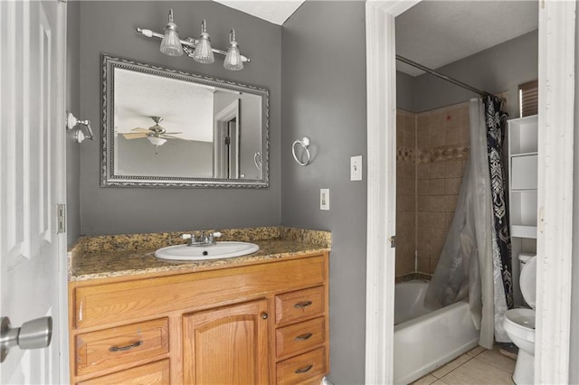 full bathroom with tile patterned floors, vanity, shower / tub combo with curtain, ceiling fan, and toilet