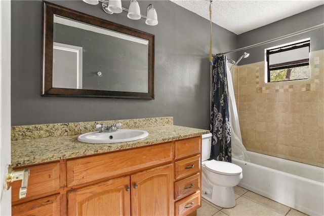 full bathroom with shower / bath combo, vanity, a textured ceiling, tile patterned flooring, and toilet