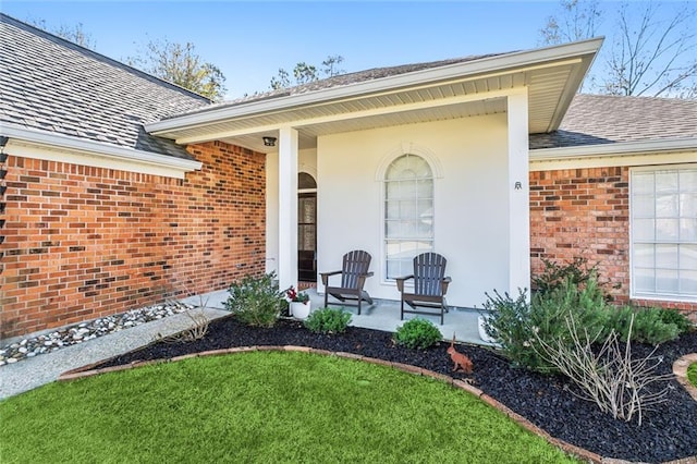 doorway to property with a yard