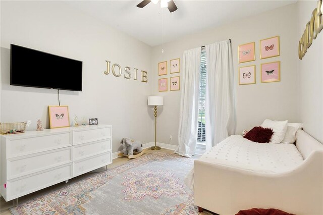 bedroom featuring ceiling fan and multiple windows