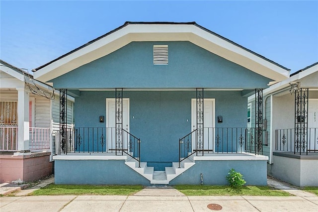 bungalow-style home featuring covered porch