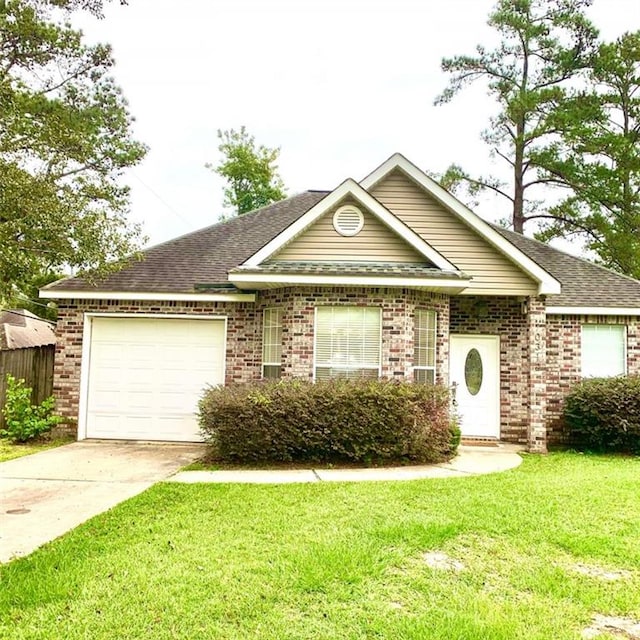 ranch-style home with a garage and a front yard