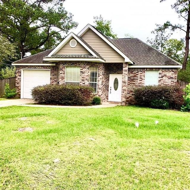 view of front facade with a front yard and a garage