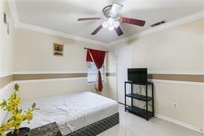 bedroom with ceiling fan and ornamental molding