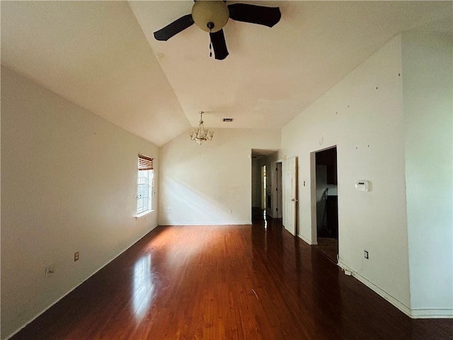 unfurnished room with dark hardwood / wood-style floors, lofted ceiling, and ceiling fan with notable chandelier