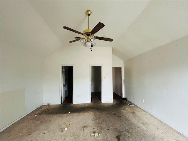 unfurnished bedroom featuring a walk in closet, ensuite bathroom, vaulted ceiling, and ceiling fan