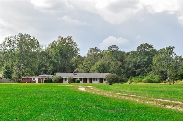 ranch-style home with a front lawn