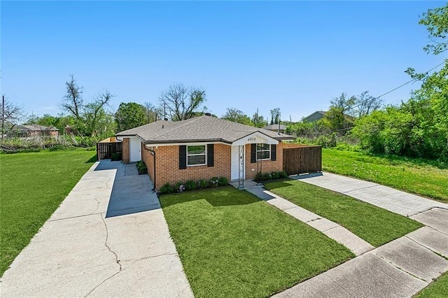 ranch-style home with a front lawn