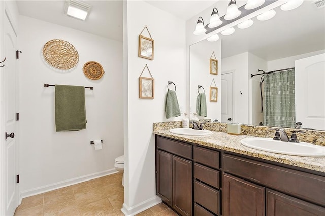 bathroom with tile patterned floors, vanity, toilet, and a shower with shower curtain