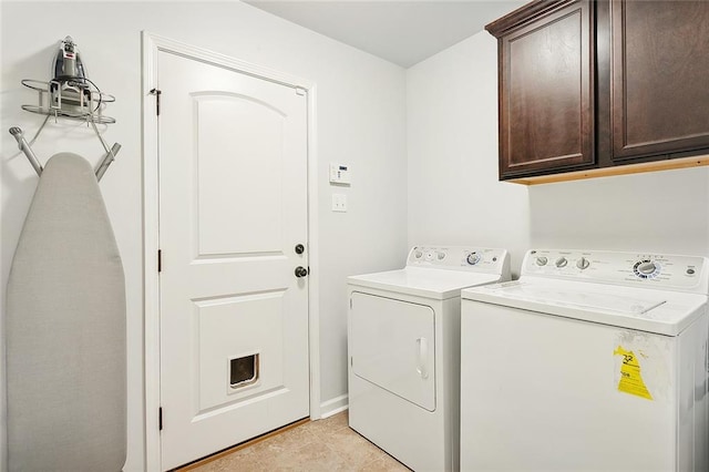 clothes washing area featuring light tile patterned floors, cabinets, and independent washer and dryer