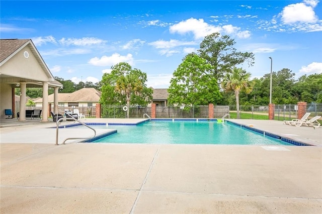 view of swimming pool featuring a patio area