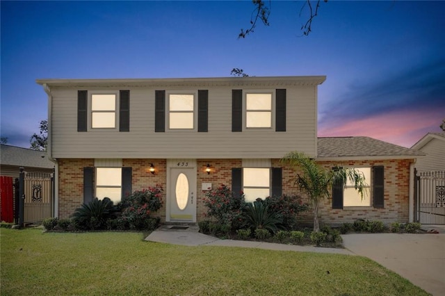 view of front of home with a yard