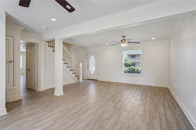 unfurnished living room featuring light hardwood / wood-style floors, ceiling fan, and ornamental molding