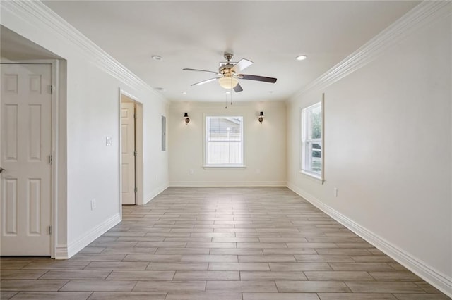 unfurnished room with ceiling fan, light hardwood / wood-style floors, and crown molding