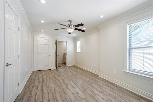 unfurnished room featuring ceiling fan, a healthy amount of sunlight, and light hardwood / wood-style flooring