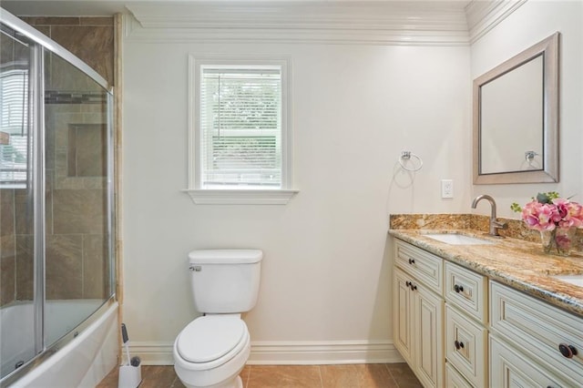 full bathroom with vanity, crown molding, shower / bath combination with glass door, tile patterned flooring, and toilet