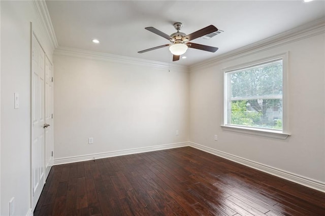 unfurnished room featuring dark hardwood / wood-style flooring, ceiling fan, and crown molding