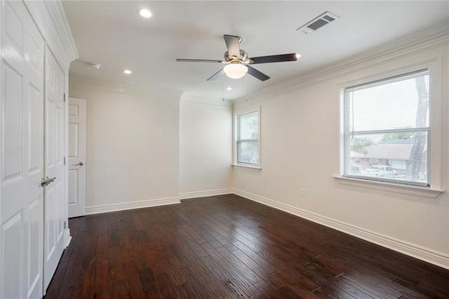 unfurnished room with crown molding, ceiling fan, and dark hardwood / wood-style floors