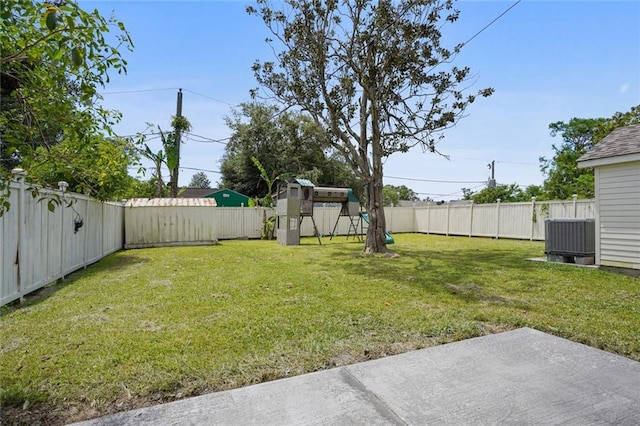 view of yard featuring central AC unit and a patio area