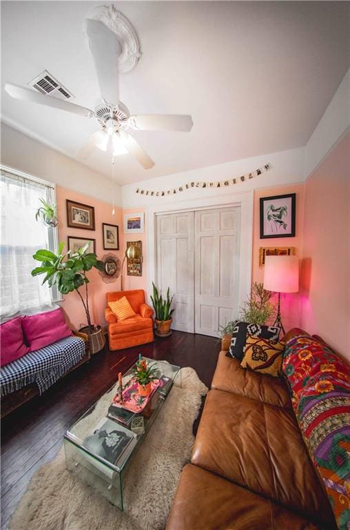 living room with ceiling fan and hardwood / wood-style floors