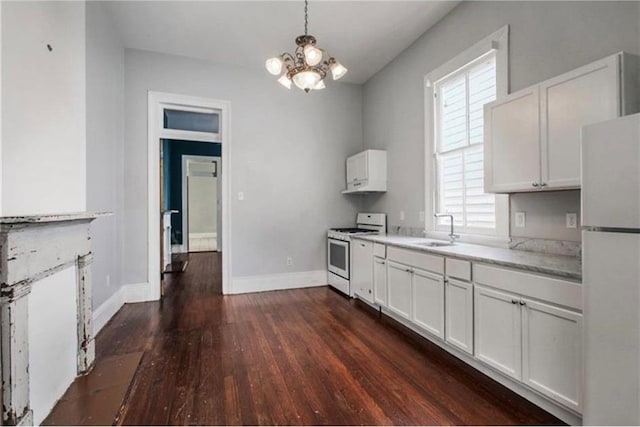 kitchen with white appliances, dark hardwood / wood-style floors, and plenty of natural light