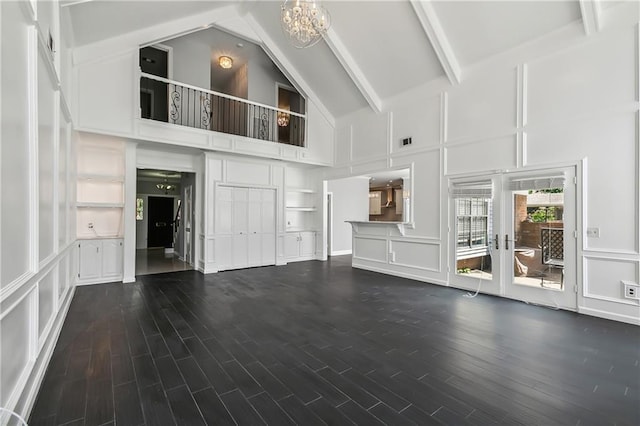 unfurnished living room with high vaulted ceiling, french doors, dark hardwood / wood-style floors, beamed ceiling, and a notable chandelier