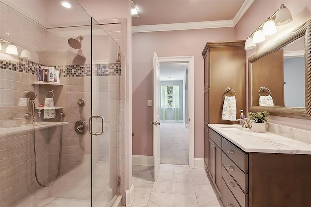 bathroom with vanity, a shower with door, and ornamental molding