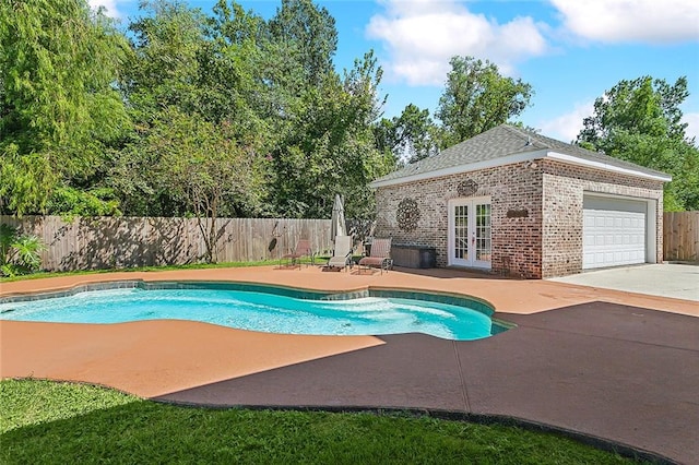 view of pool with french doors