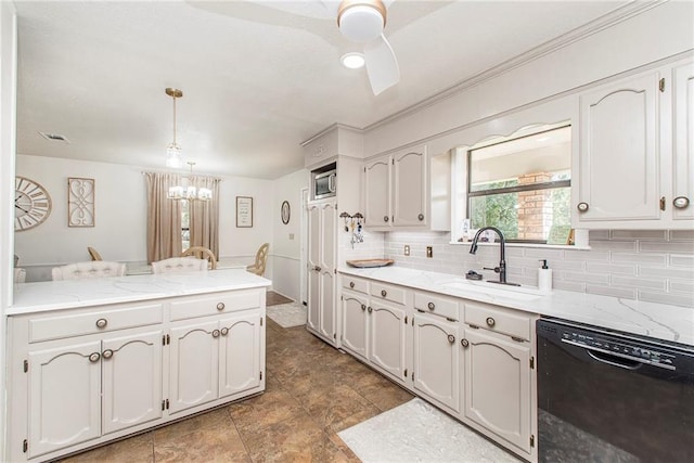 kitchen featuring pendant lighting, white cabinets, sink, and black dishwasher