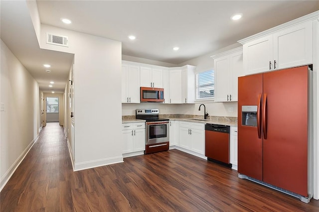 kitchen with white cabinetry, sink, dark wood-type flooring, and stainless steel appliances