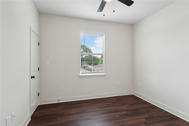 empty room featuring ceiling fan and dark hardwood / wood-style flooring