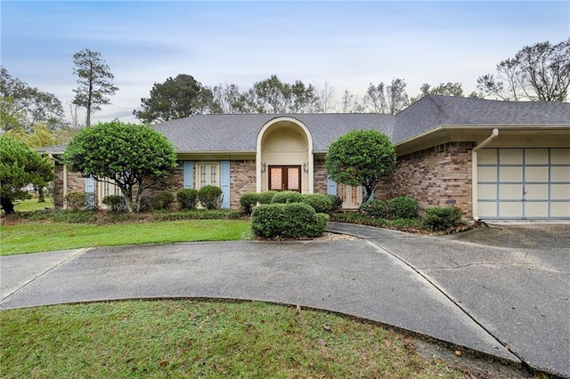 1391 E Ashton Ct, Slidell, LA 70460 - single story home featuring driveway, a garage, brick siding, a front lawn, and a shingled roof