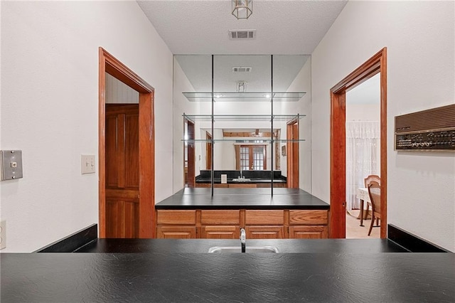 1391 E Ashton Ct, Slidell, LA 70460 - kitchen featuring dark countertops and a sink