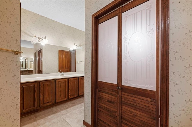 1391 E Ashton Ct, Slidell, LA 70460 - bathroom with vanity, tile patterned floors, and wallpapered walls