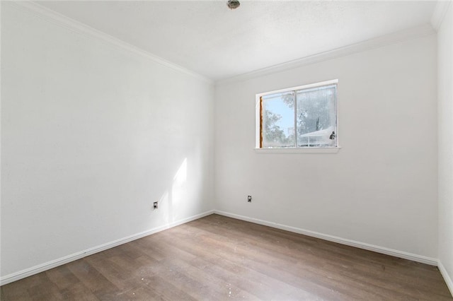 unfurnished room with crown molding and hardwood / wood-style floors